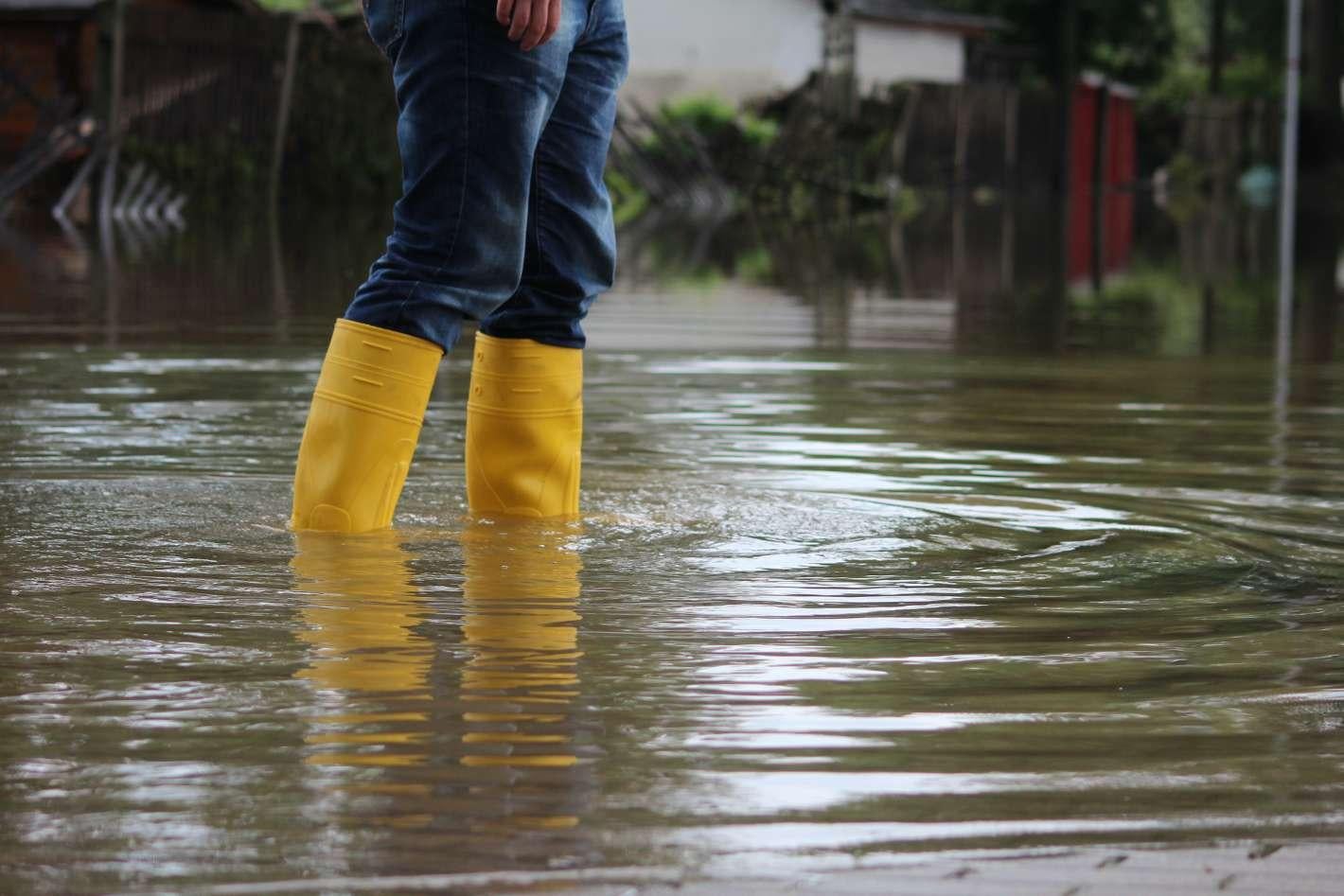 woman in flood with rain boots