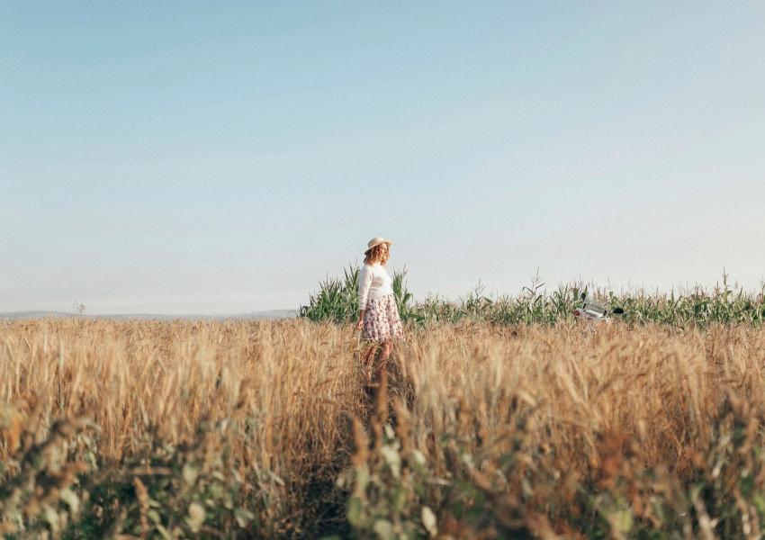 Woman standing in a field.